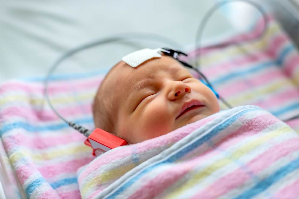 A newborn during hearing screening