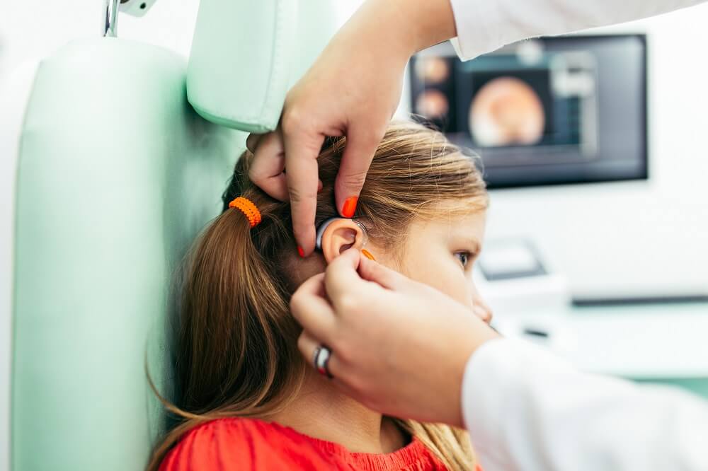 A small girl during Auditory processing disorder testing at Denton Hearing Health Care